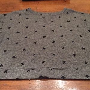 This is a cropped top sweater-t